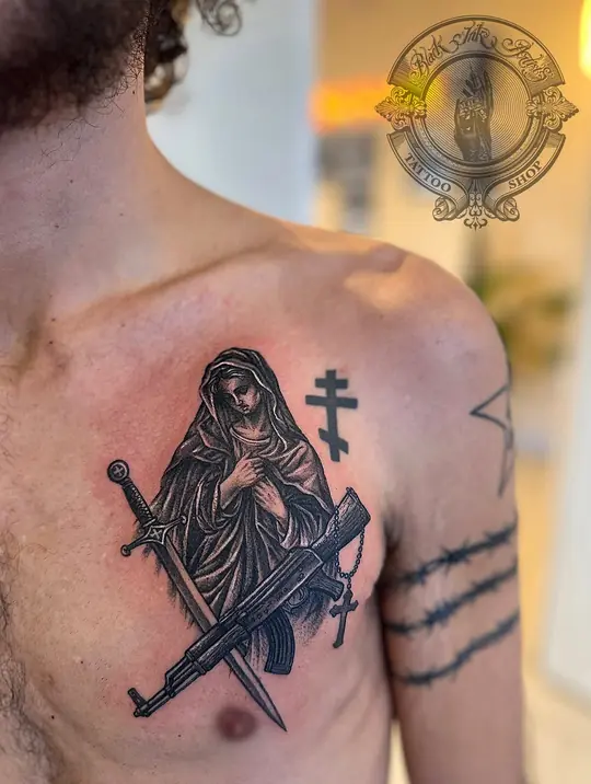 Large blackwork piece on upper arm and chest