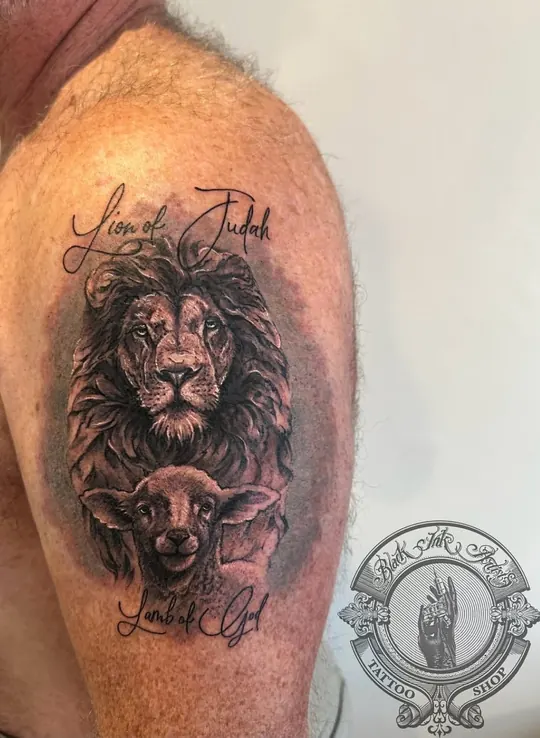 Realism lion and lamb on the shoulder with the script Lion of Judah and Lamb of God