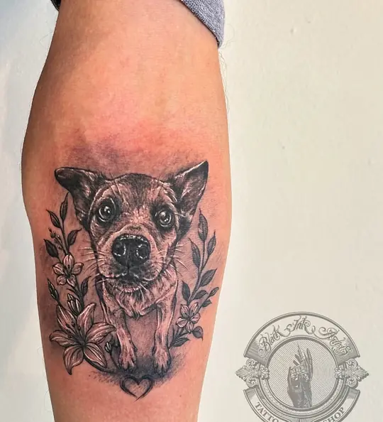 Dog portrait tattoo on forearm
