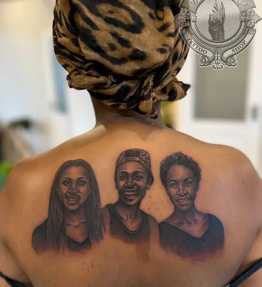 Three portrait tattoo on upper back